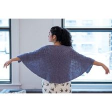 Semi circular shawl with geometric texture.