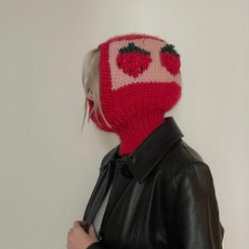Red balaclava with huge colorwork strawberries in a band around the back of the head.