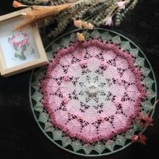 Round crochet in a hoop that looks like a flower.