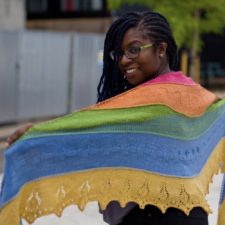 Triangular shawl with horizontal stripes and a bit of openwork.