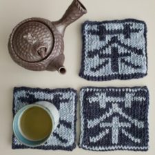 Three double-knit coasters with the Japanese character for tea, along with a teapot.