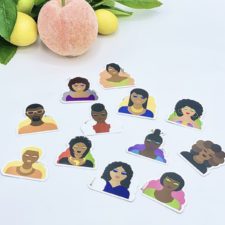 2-inch high stickers of the head and torso of a variety of Black people, same drawings as on tote bags and journals on the site.