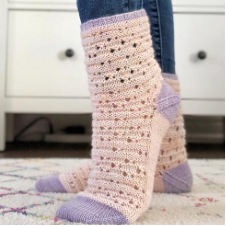 Cute socks with yarnover openwork throughout.