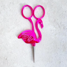 Very very pink sewing scissors, shaped like a flamingo.