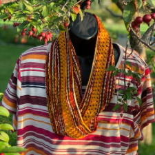 Slipstitch and lace infinity cowl shown in fall colors.