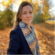 Long, colorwork cowl with wide stripes and geometric shapes.