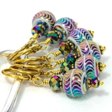 Multicolor stitch markers with wavy design on largest round bead.