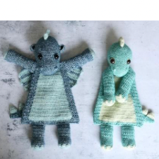 Crocheted rag dolls, one with wings to make it a dragon. They have flat, triangular bodies and cute tails with little spikes.