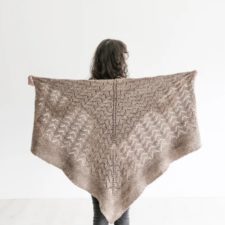 Large, square shawl that is mostly lace with solid edging about 6 inches wide.