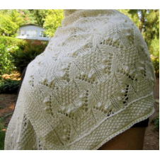 Rectangular shawl with Estonian gathered and lace stitches.