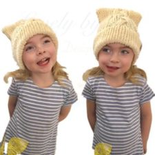 Children’s hat with cable up the front. Square edges form “kitty ears” at the top.