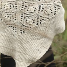 Heavier triangular shawl with garter etch and lace pattern throughout.
