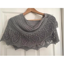 This is a pattern for a fairly long wingspan crescent shaped shawlette. The beaded bottom is complimented by a lovely lace stitch that adds a wonderfully delicate finish to this piece.