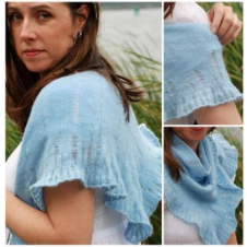 Wide triangular shawl with laddered details and a gently ruffled edge.