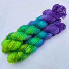 Variegated yarn goes from purple to neon green.