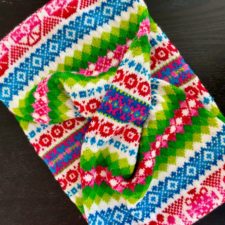 Fair Isle cowl in very bright colors. Resembles Eastern European embroidery.