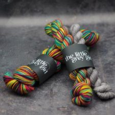 Bright, self-striping yarn with neutral mini for heels and toes.