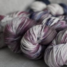 Bulky skeins in berry colors and neutrals.