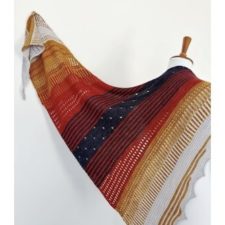 Rectangular shawl with 3-inch stripes in different colors and textures.