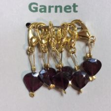 Faceted garnets on lobster claw clasps.