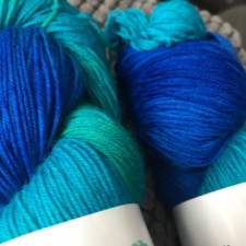 Variegated yarn in water shades.