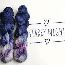 Two skeins are half deep, night-sky blue and half speckled purples and pinks.