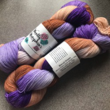 Warm biscuit colors and cool purples in a variegated yarn.