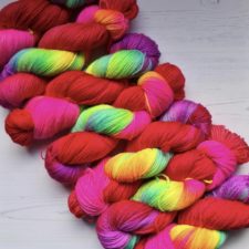 Very bright variegated yarn with red as dominant color.
