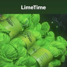 Stack of neon green skeins. Label declares “We Out Here.”