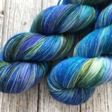 Variegated yarn skeins in sea colors.