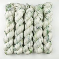 Light yarn with pea-green speckles