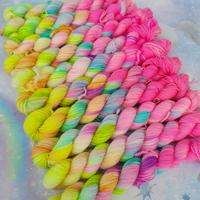 Array of pastel neon rainbow skeins.