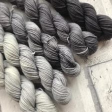 Gradient set of mini skeins in cool neutrals.