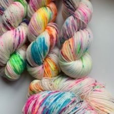 Rainbow colors in patches on white base.