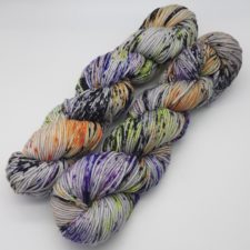 Speckled yarn in Halloween colors on a medium tone base.