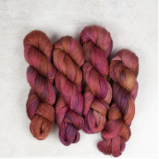 Swirly variegated yarn in berry colors