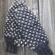 Mittens have light roving pulled through every half-inch or so in diagonal lines.