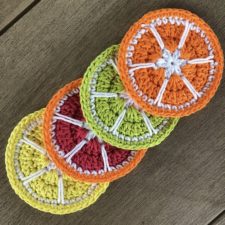 Coasters that look like sliced oranges, lemons, limes and grapefruit.