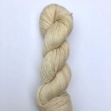 Beige yarn with pinkish cast.