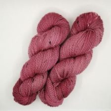 Tweed yarn in a berry jam color.