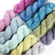Ten solid skeins in various light and medium colors.