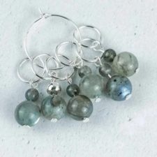 Set of six stitch makers with main Labradorite bead and smaller bead in same stone on top.