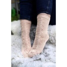 Socks with frost flower lace down the top of the calf and foot.