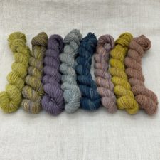 8 mini skeins in muted colors.