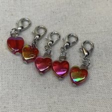 Red heart-shaped charms with lobster closures.