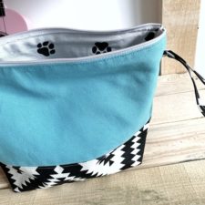 Project bag in two fabrics with dog paw print inside.