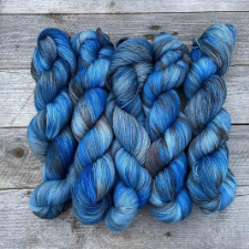 Variegated yarn in complementary blues and grays.