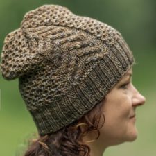 Slouchy hat, mostly textured with one wide vertical cable section.