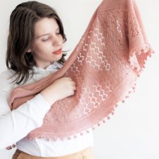 Crescent shawl with hexagonal lace and bobble lower edge.