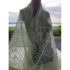 Delicate laceweight rectangular shawl with palm frond motifs.